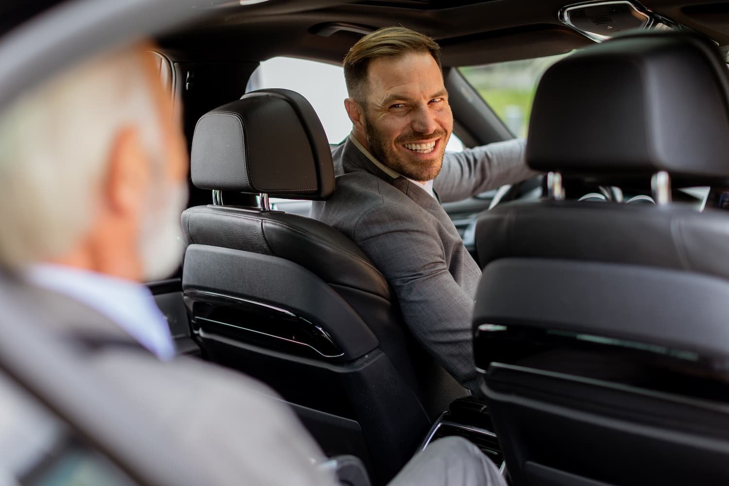 Home 5 smiling-passenger-engaging-in-friendly-conversatio-2025-02-21-09-05-15-utc-1